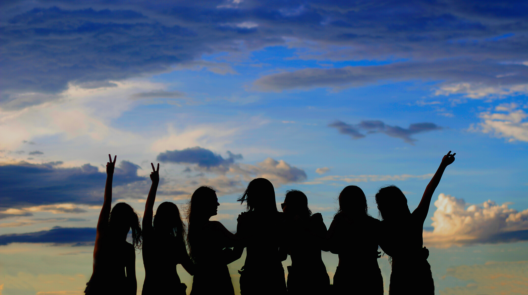 Silhouette Photo Of Women Under Blue Sky
